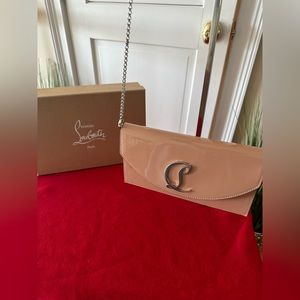 AUTHENTIC Christian Louboutin Beige Patent leather clutch bag.